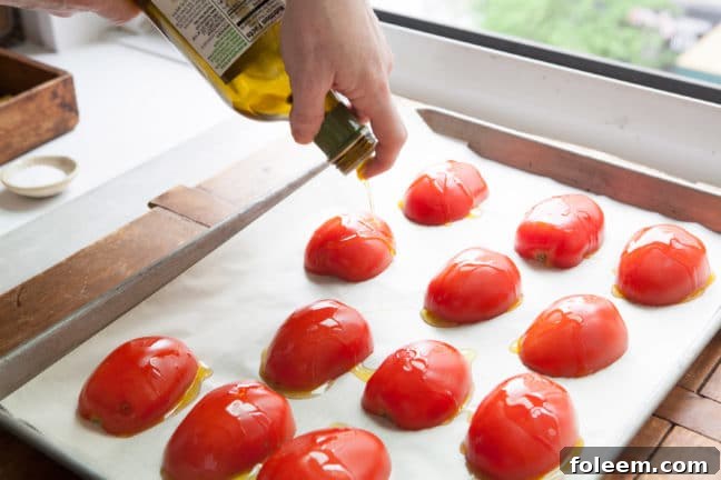 Drizzling olive oil over tomatoes