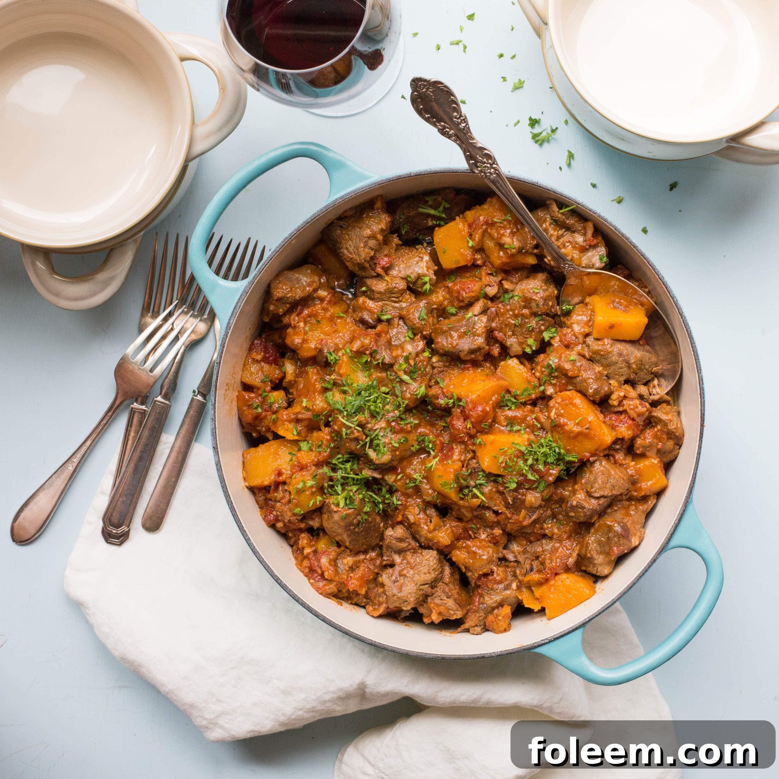 Moroccan Lamb and Butternut Squash Stew  in a blue pot.
