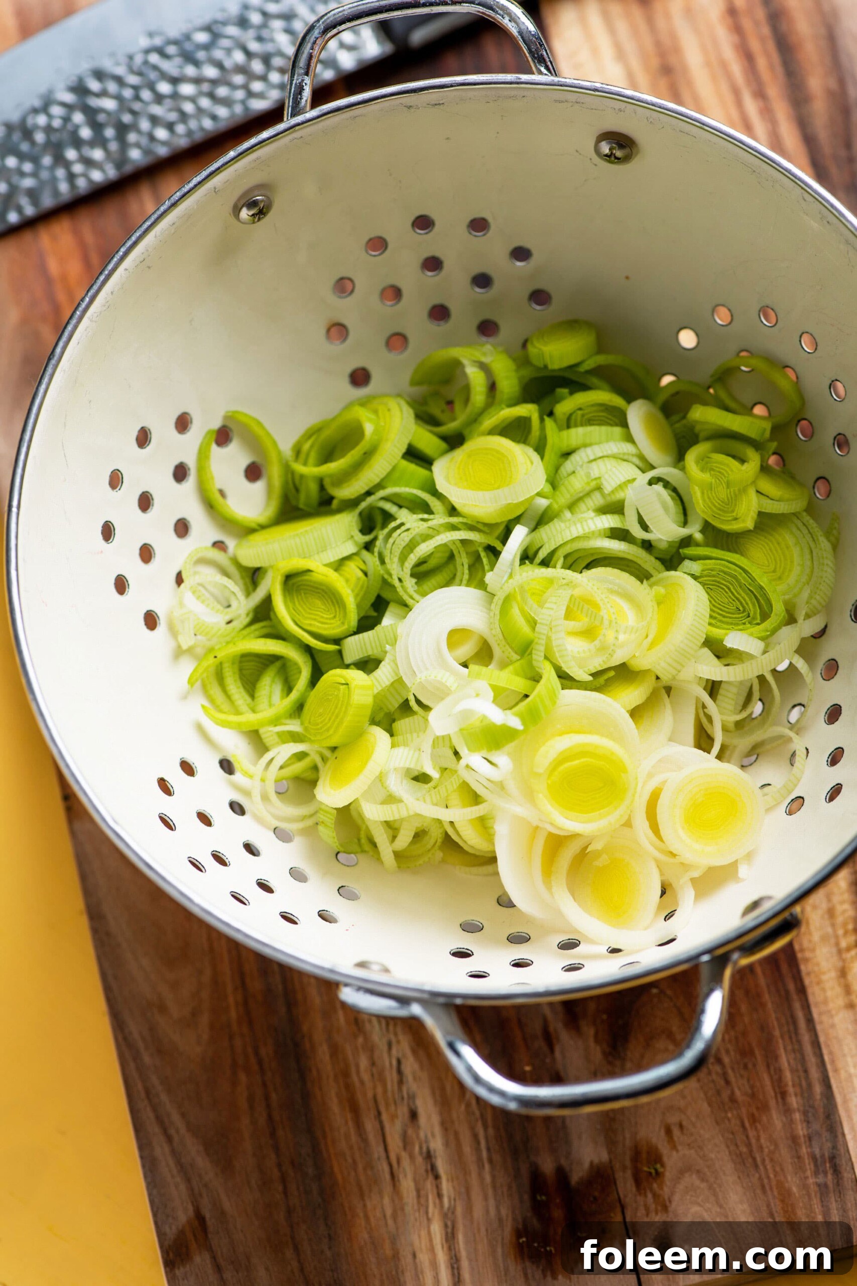 Sliced leeks in a colander.