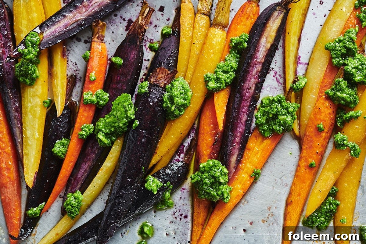 Dollops of spinach parsley pesto on Roasted Carrots.