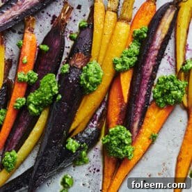 Dollops of spinach parsley pesto on Roasted Carrots.