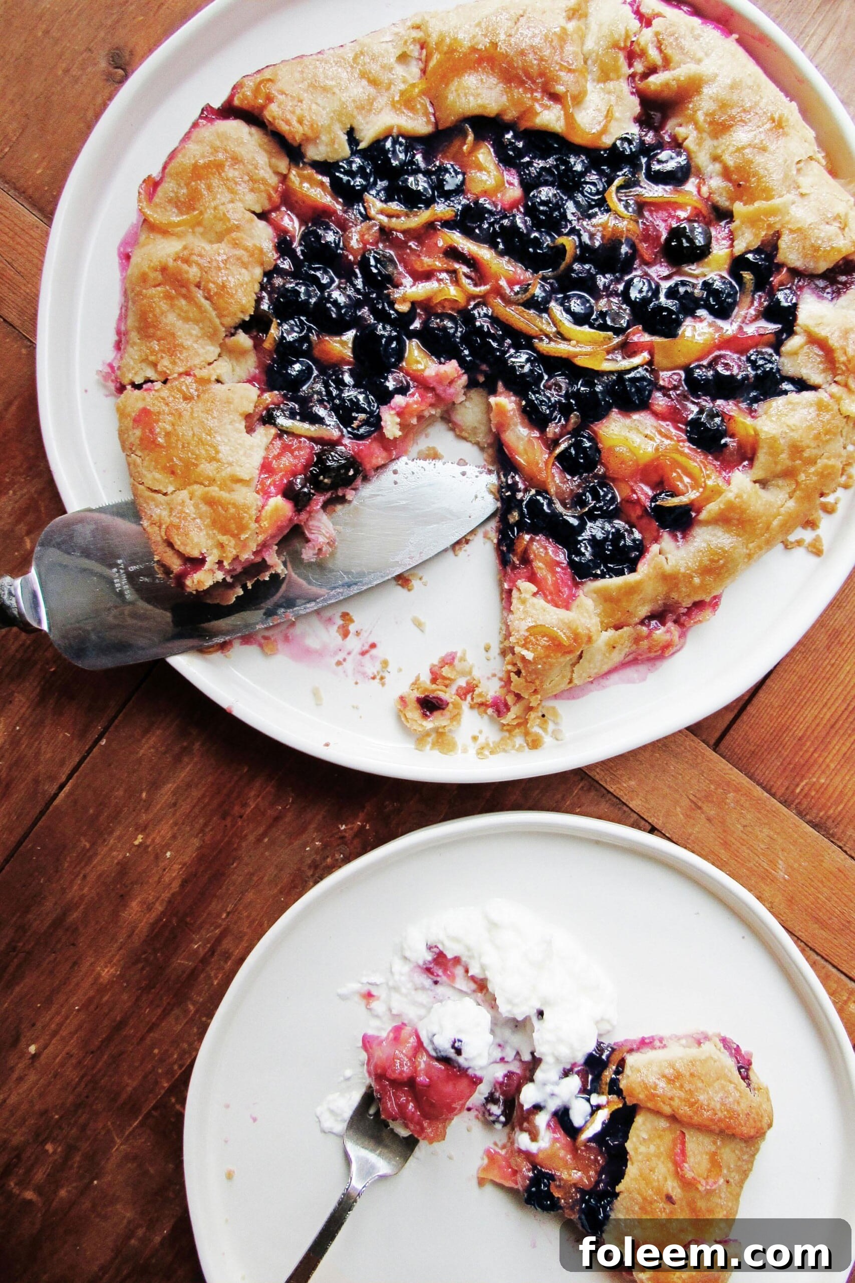 Yellow plum and blueberry galette on a plate.