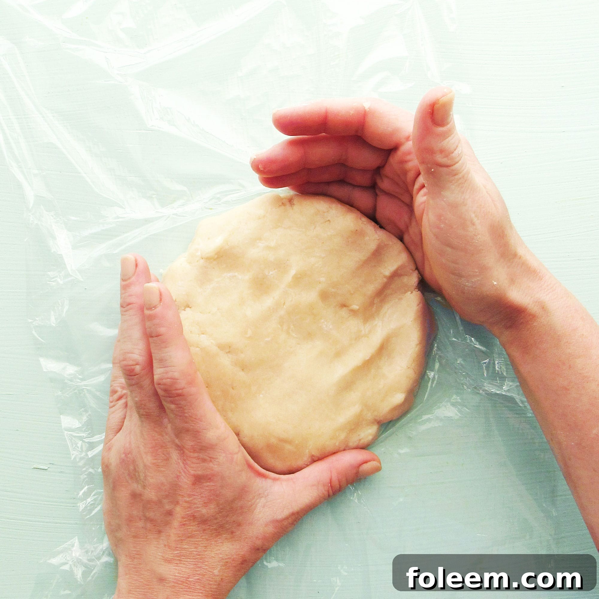Forming crostata dough into a disk for chilling.