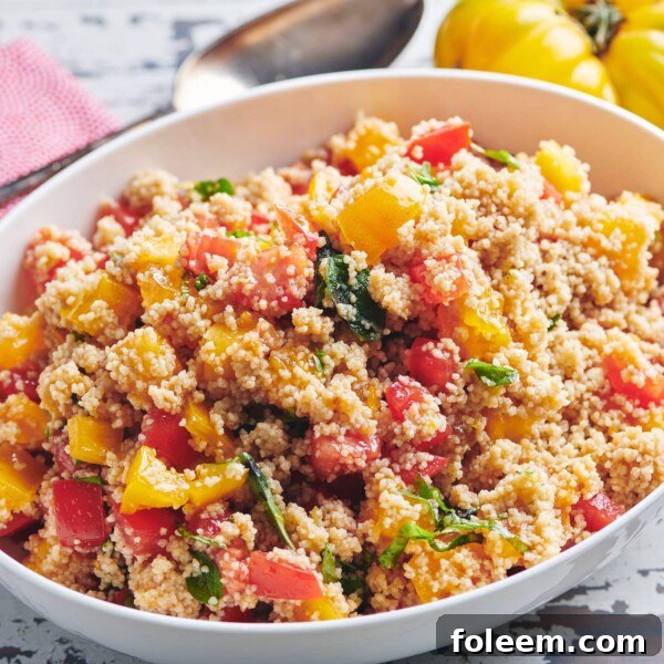 White, oblong bowl of Tomato Bruschetta Couscous.