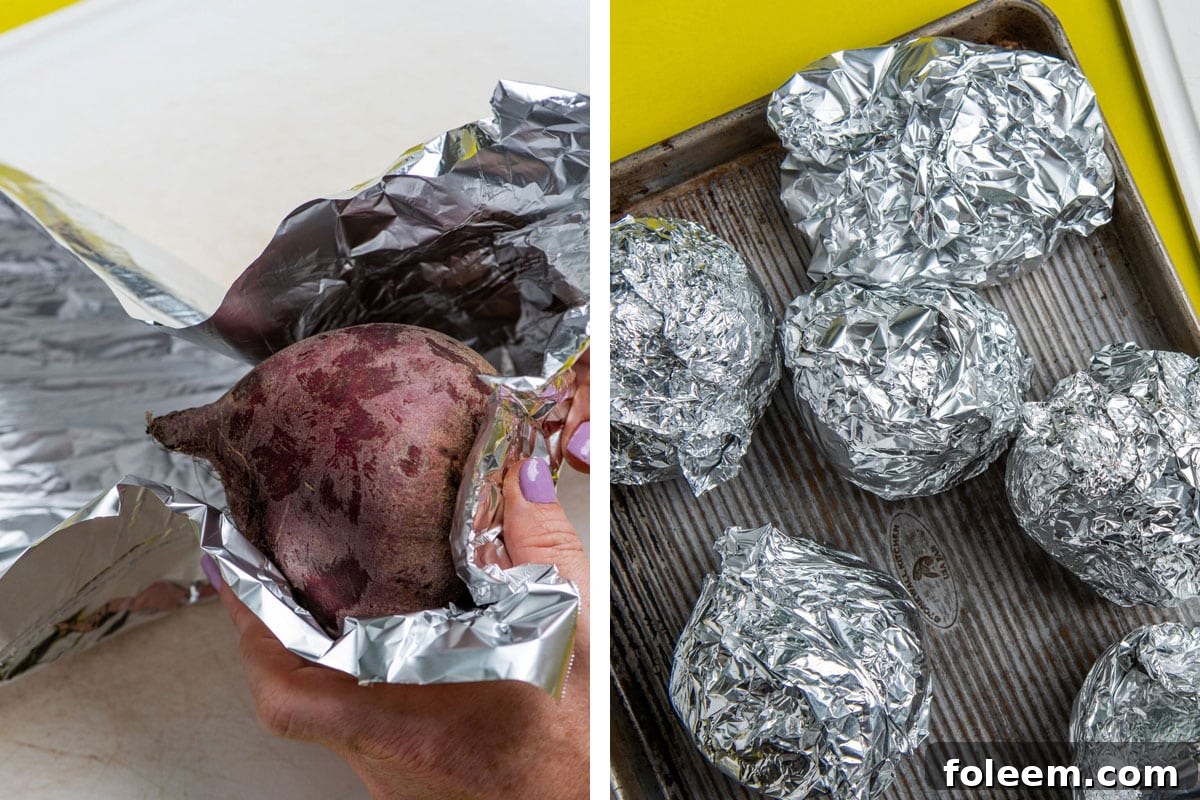 Wrapping red beets in foil and piling on baking sheet.