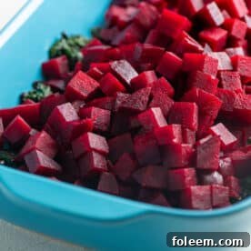 Beets and Sauteed Beet Greens in a blue baking dish.