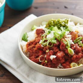 Ground beef chili on plate over rice