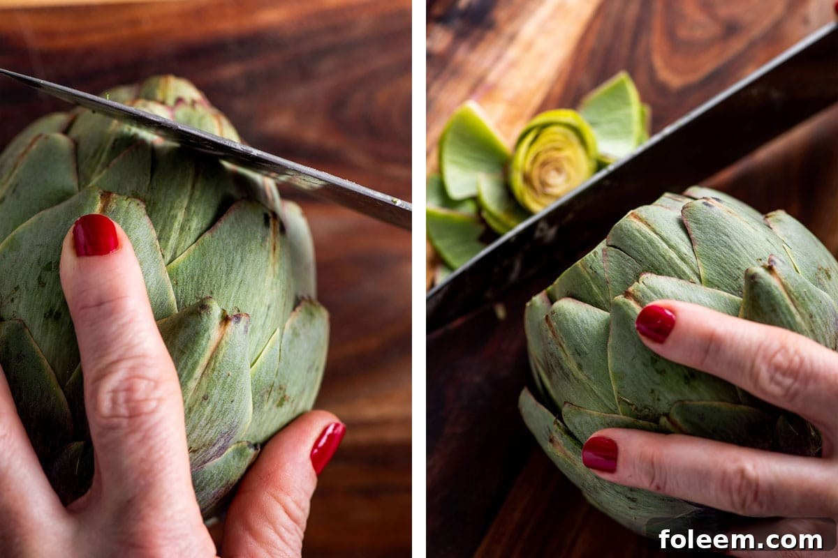 Trimming the top off fresh artichoke with large knife.