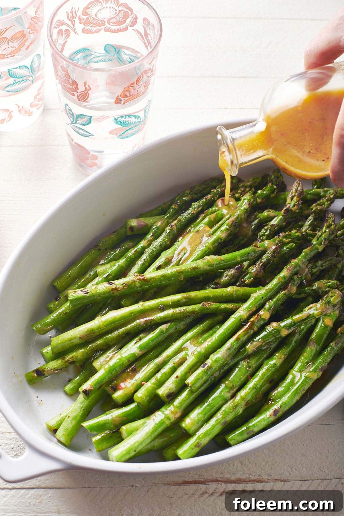 Drizzling vinaigrette over Grilled Asparagus.