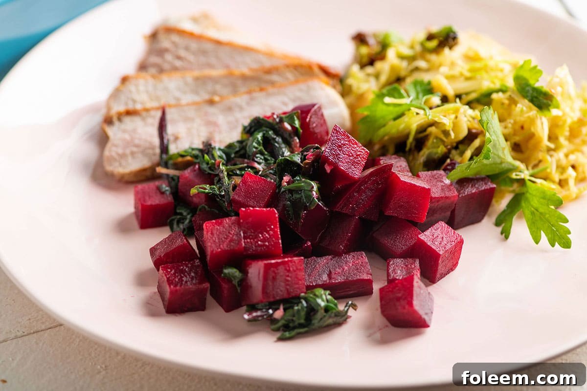 Beets and Sauteed Beet Greens on white plate.