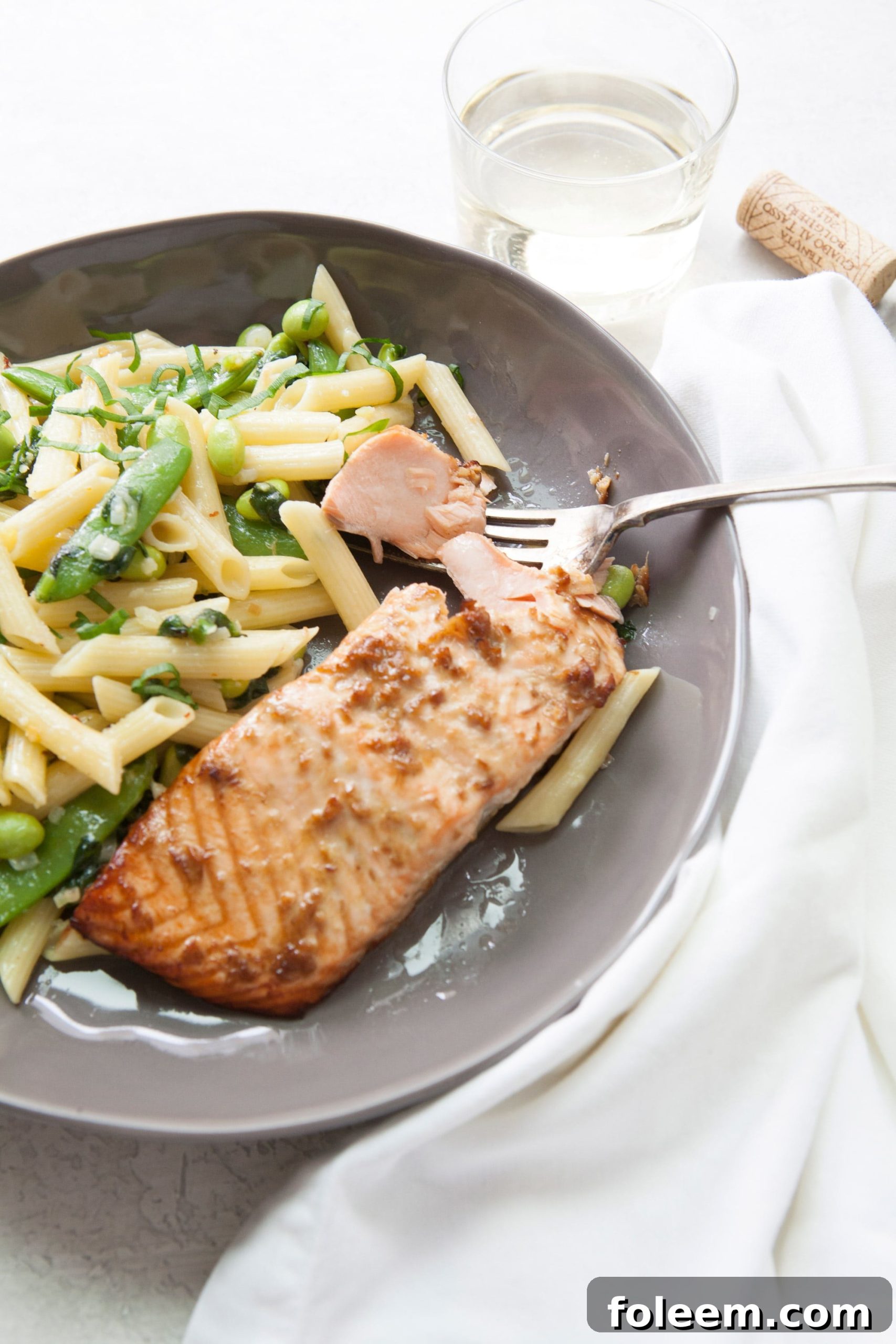 Horseradish Ginger Salmon on grey plate with pasta.