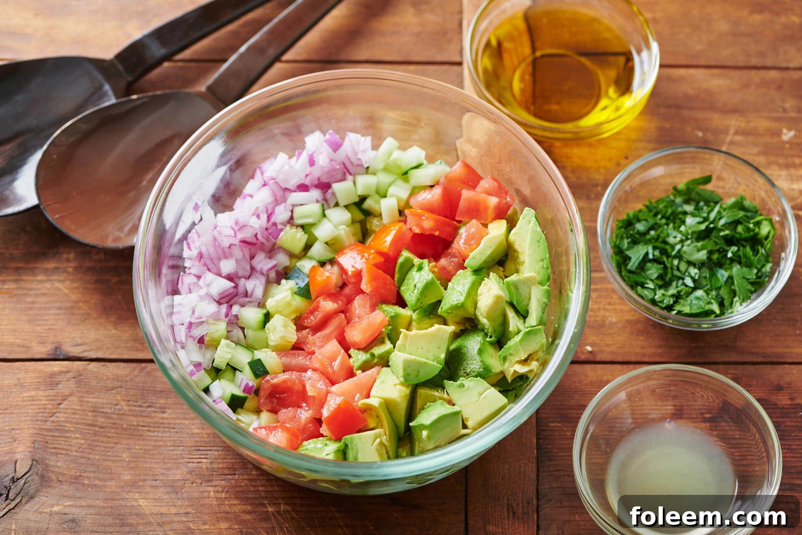 Ingredients for Tomato, Avocado and Cucumber Salad in a bowl