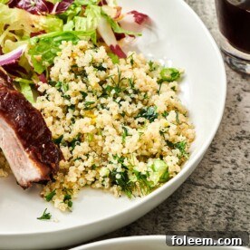 Quinoa salad on white plate with ribs