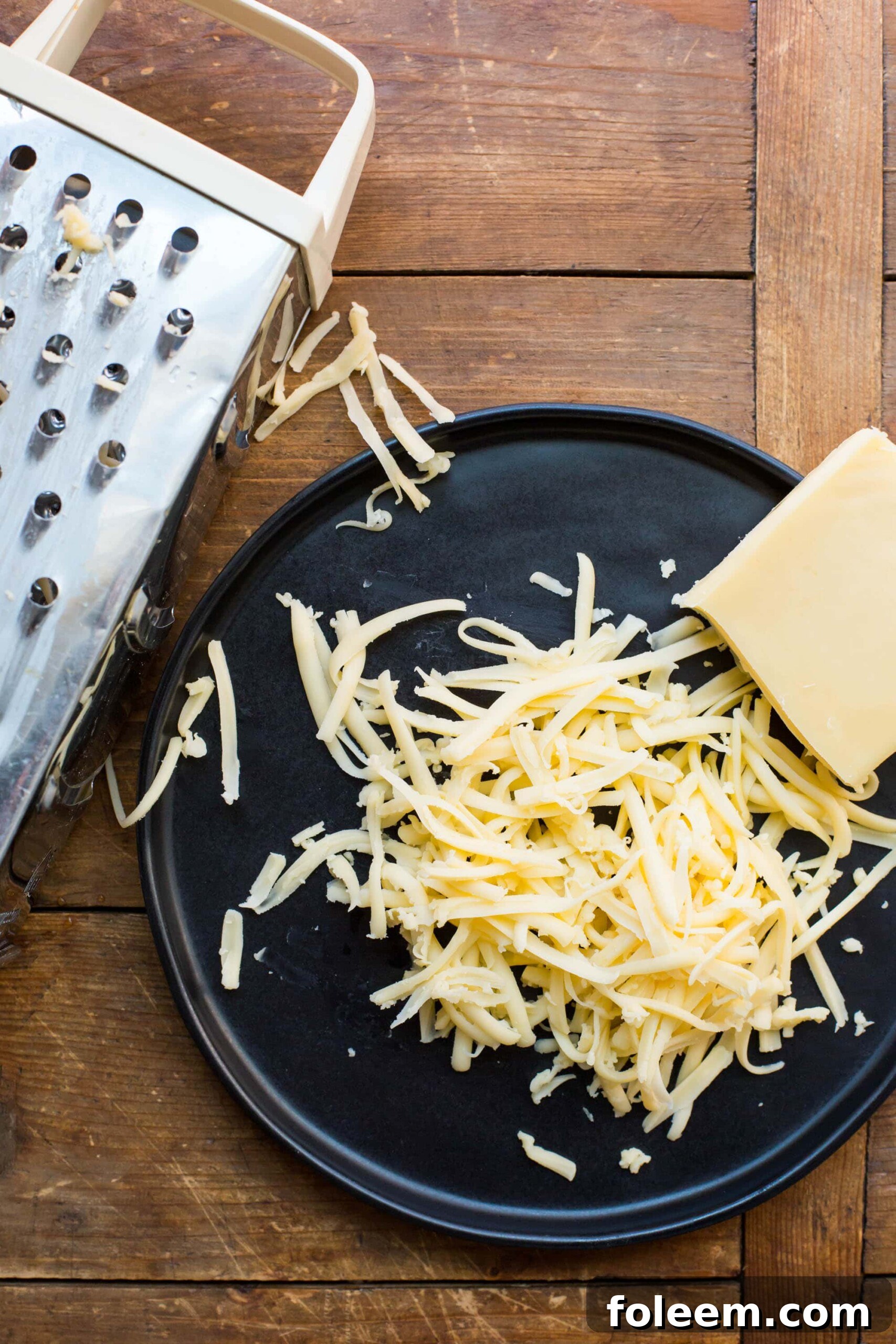 Grating Cheese / Katie Workman / themom100.com / Photo by Mia