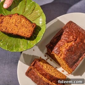Apple pumpkin bread loaf and slice on plates.