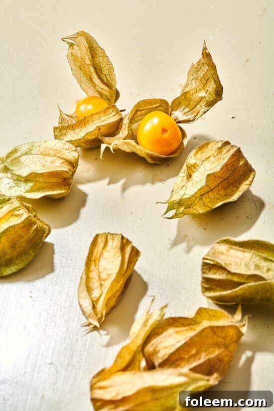 Golden berries on a white countertop.
