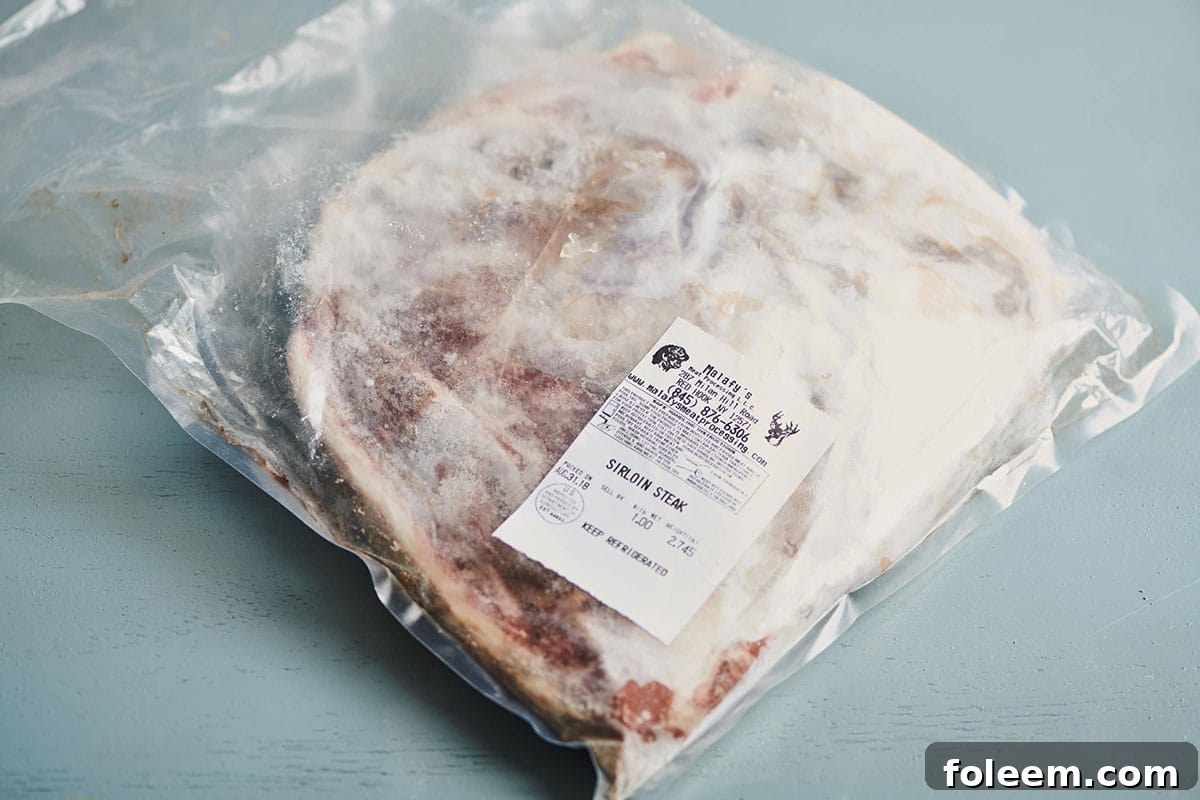 Frozen sirloin steak in plastic bag
