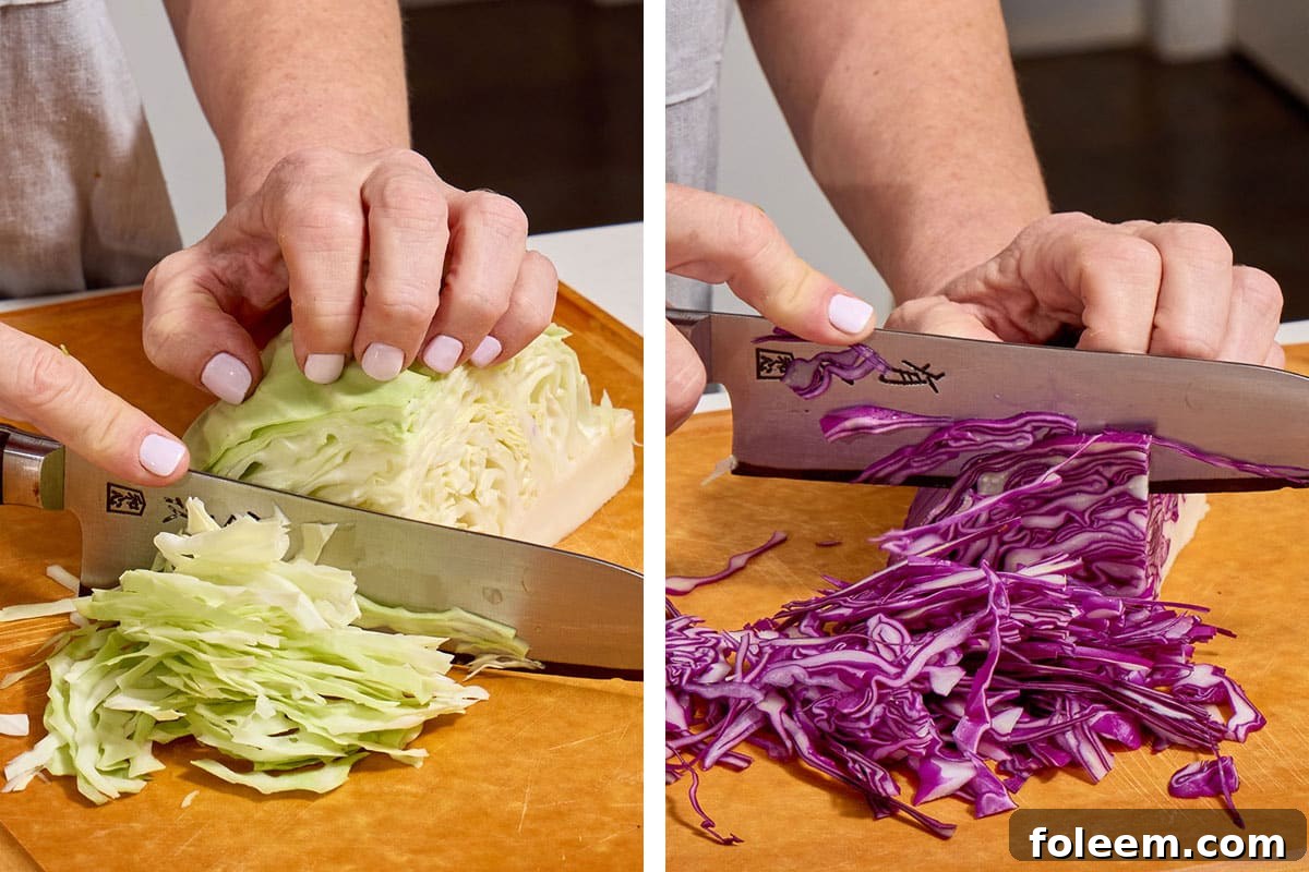 Woman slicing green and red cabbage on cutting board.