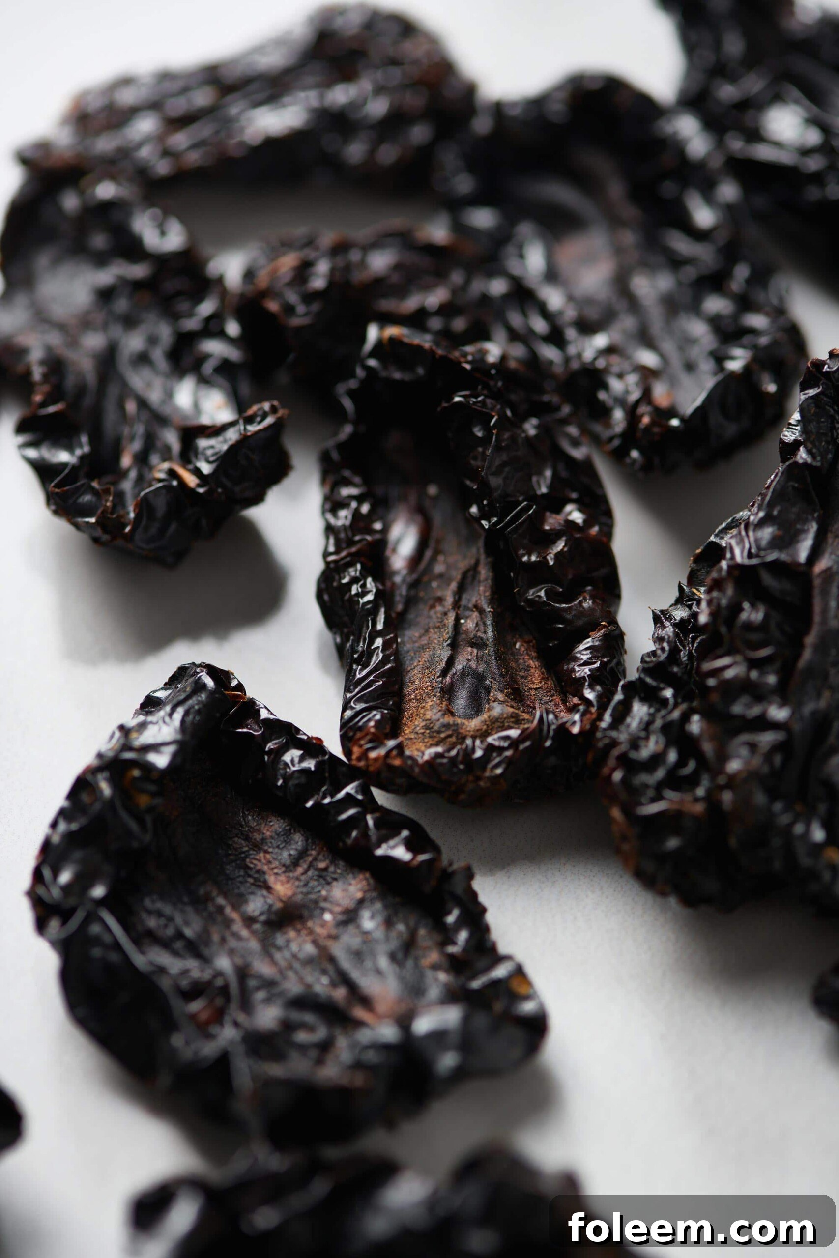 Dried tomatoes on parchment paper.