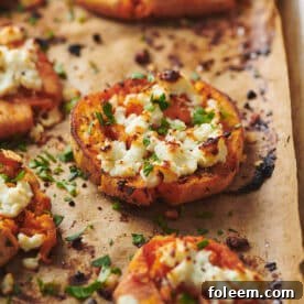 Smashed Garlic Butter Sweet Potatoes with Feta on baking sheet.