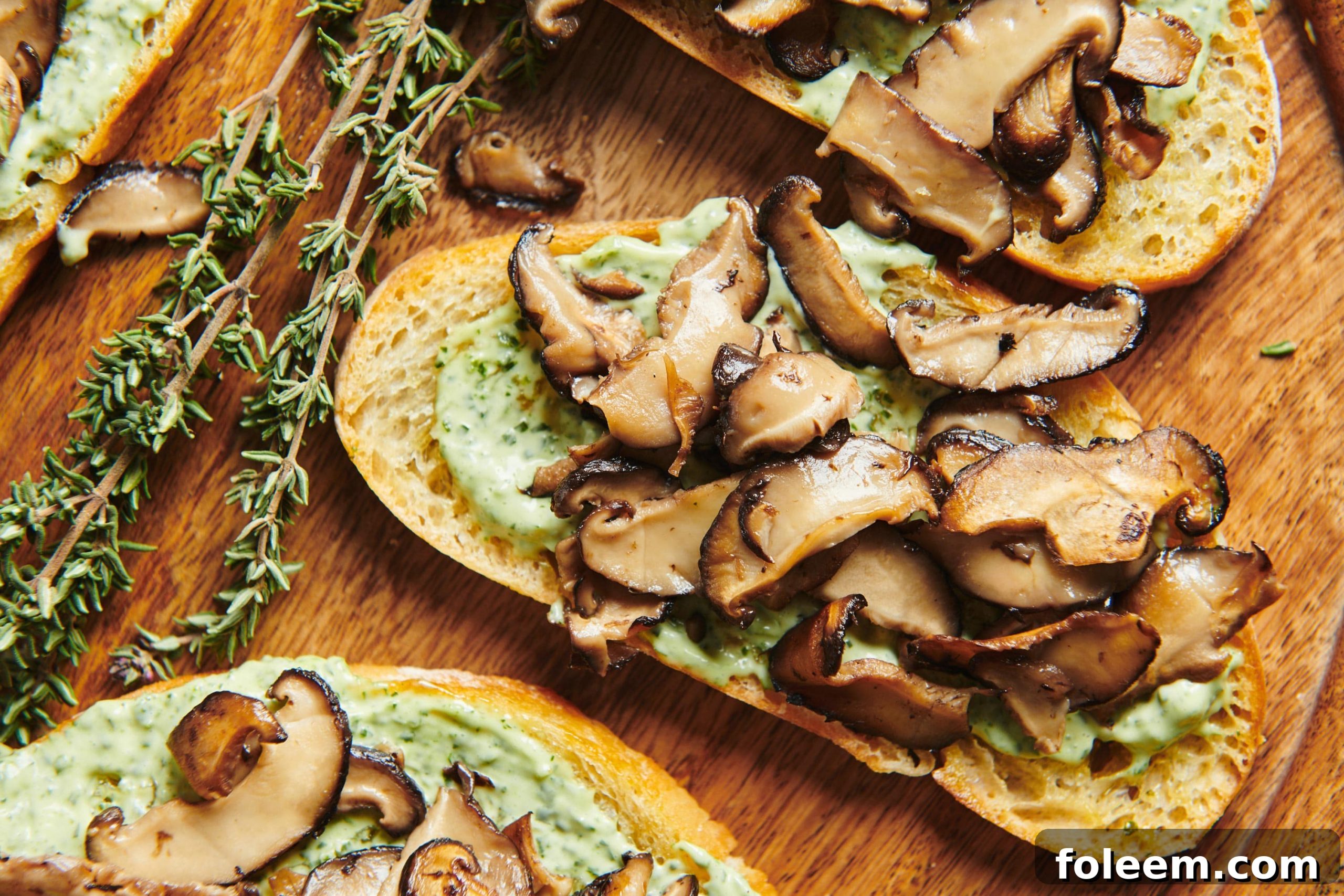 Mushroom Bruschetta with Herbed Mayonnaise on wood board.
