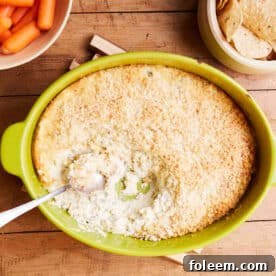 Hot Jalapeno Popper Dip in a yellow baking dish.