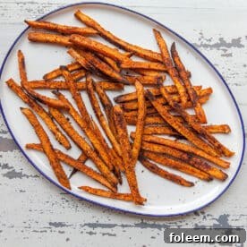 Sweet potato fries on white plate.