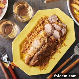 Braised Pork with Cabbage and Apples on a platter.