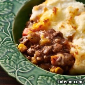 Cottage Pie in a blue-green bowl.