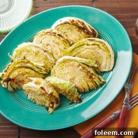 Blue plate with eight Roasted Cabbage Wedges.