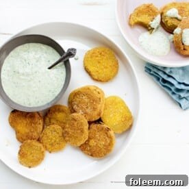 Plates with Fried Green Tomatoes and Green Goddess Dressing.