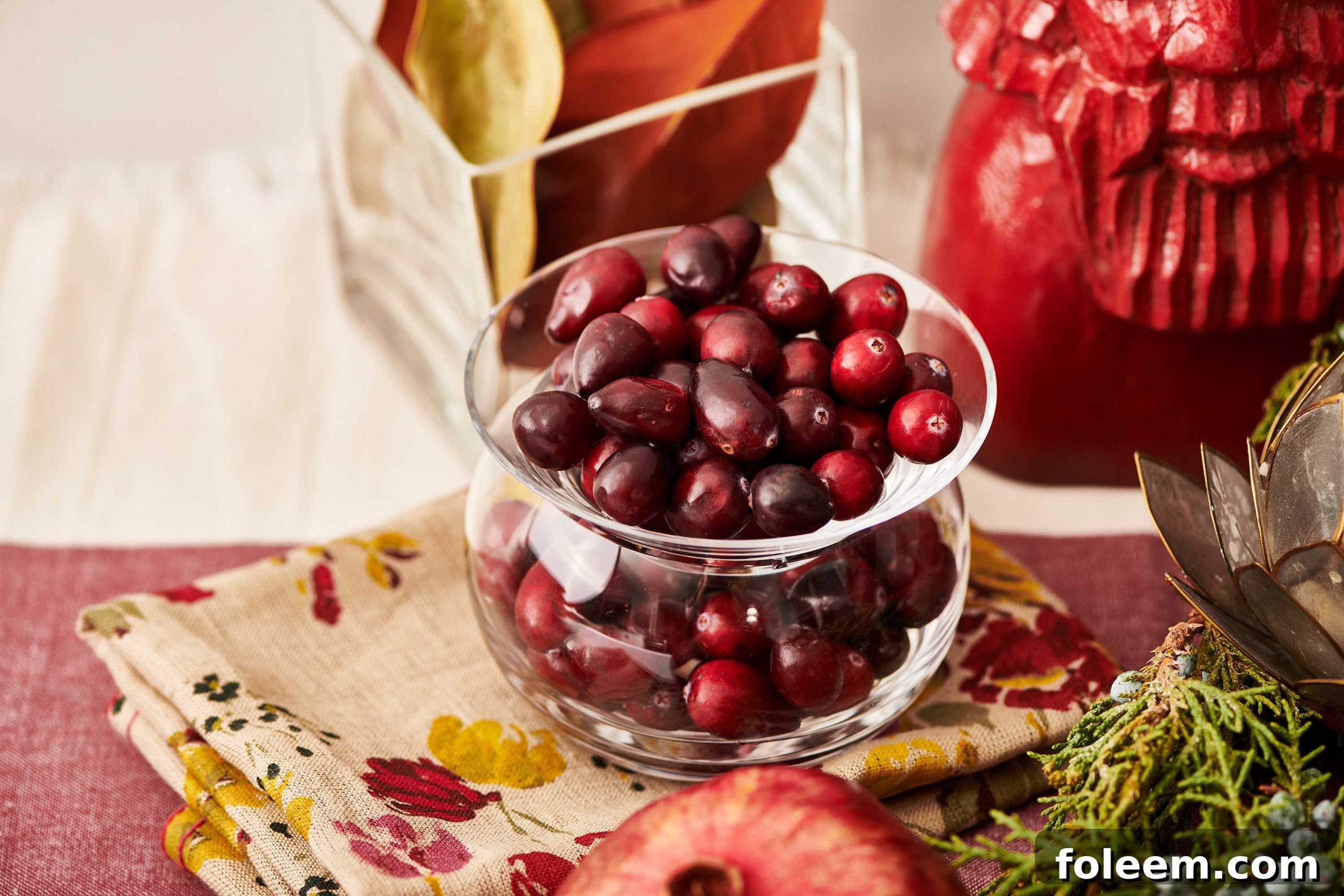 Small glass bowl of cranberries.