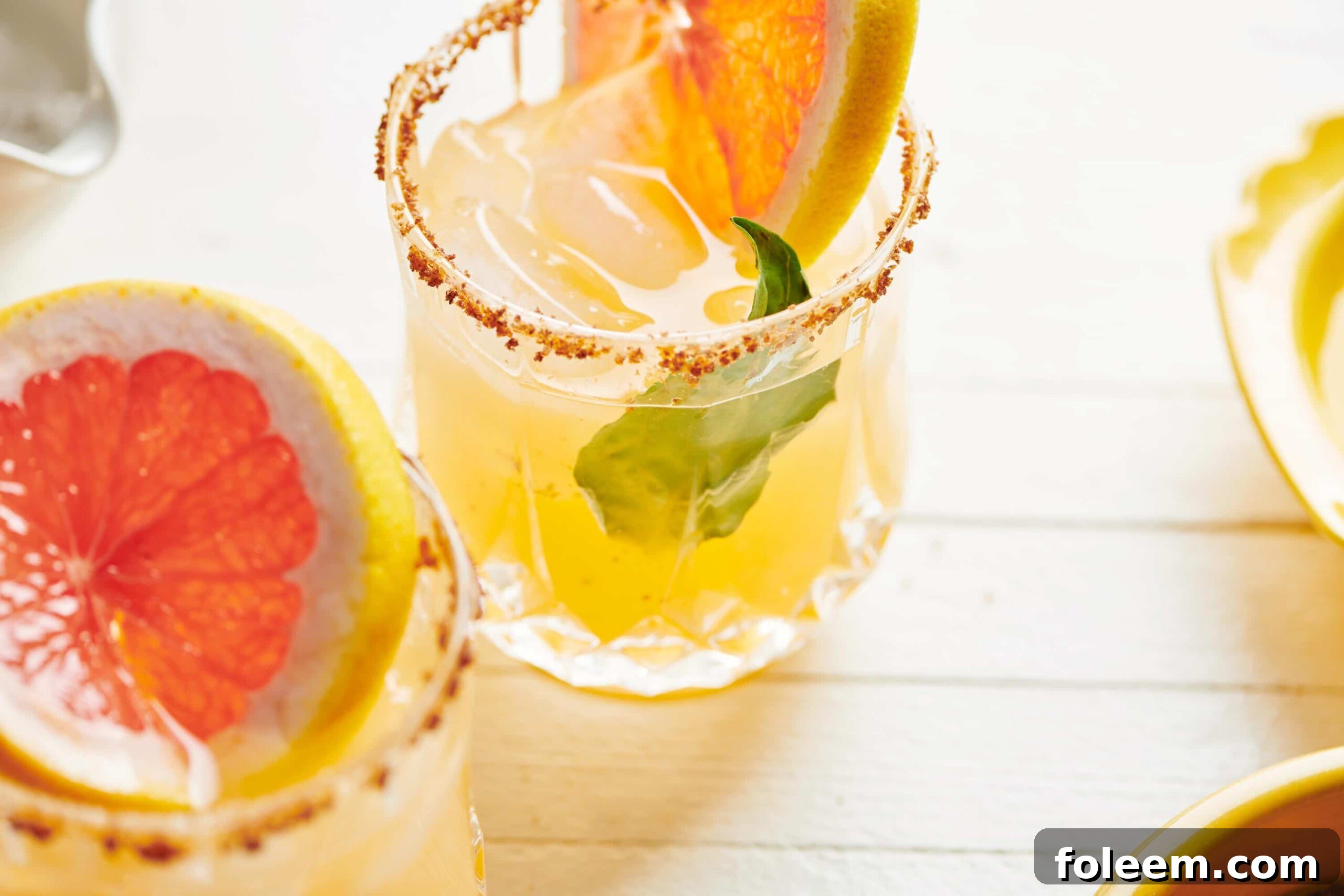 Pomelo Paloma in glasses on table.