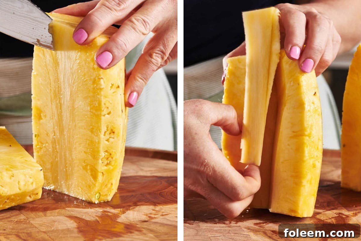 Woman using a knife cut out pineapple core.