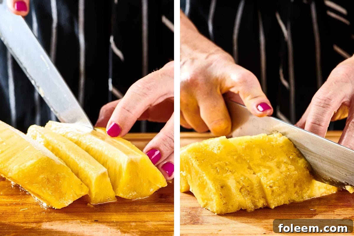 Woman slicing fresh pineapple with knife.