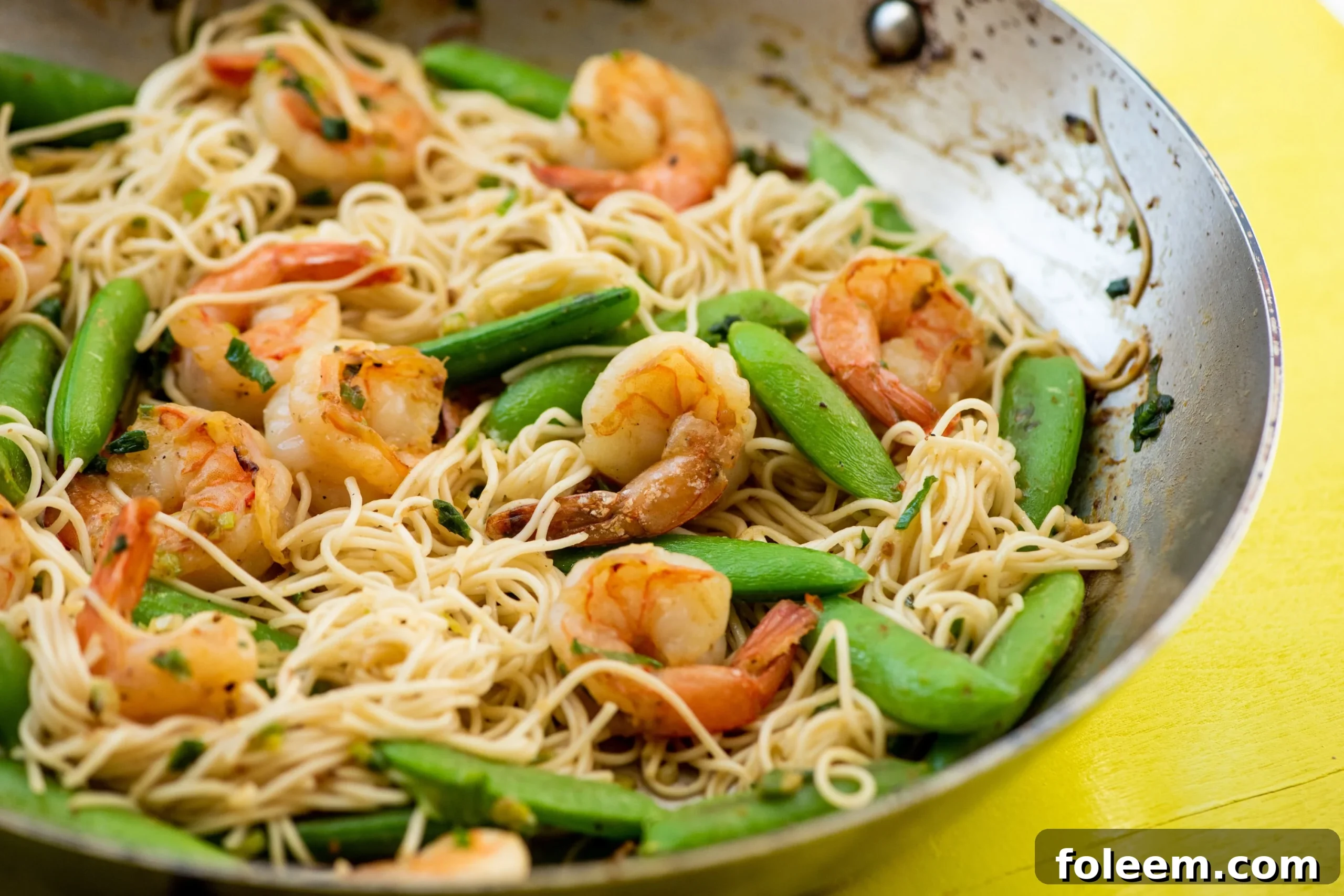 Shrimp, Sugar Snap Pea and Scallion Stir Fry with Miso Sauce in a pan.