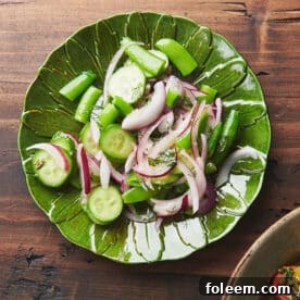 Sugar snap pea salad on green plate.