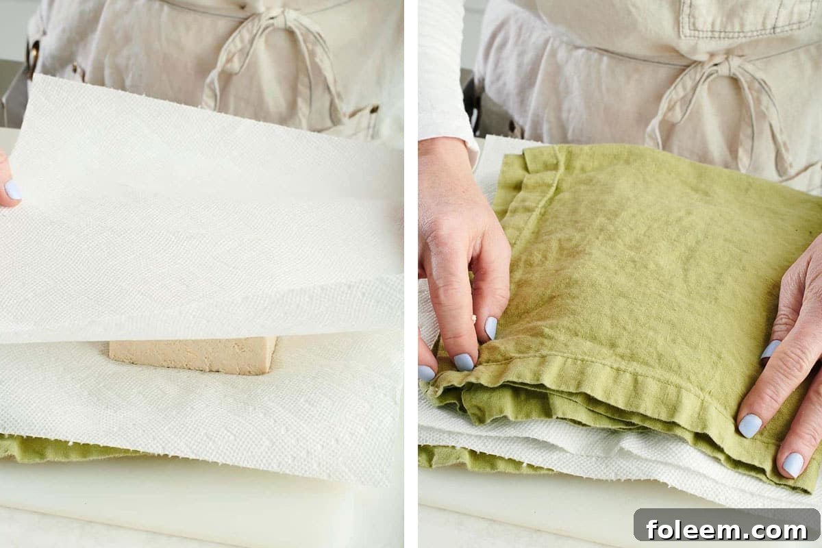 Woman placing paper towels and green cloths onto a stack of tofu.