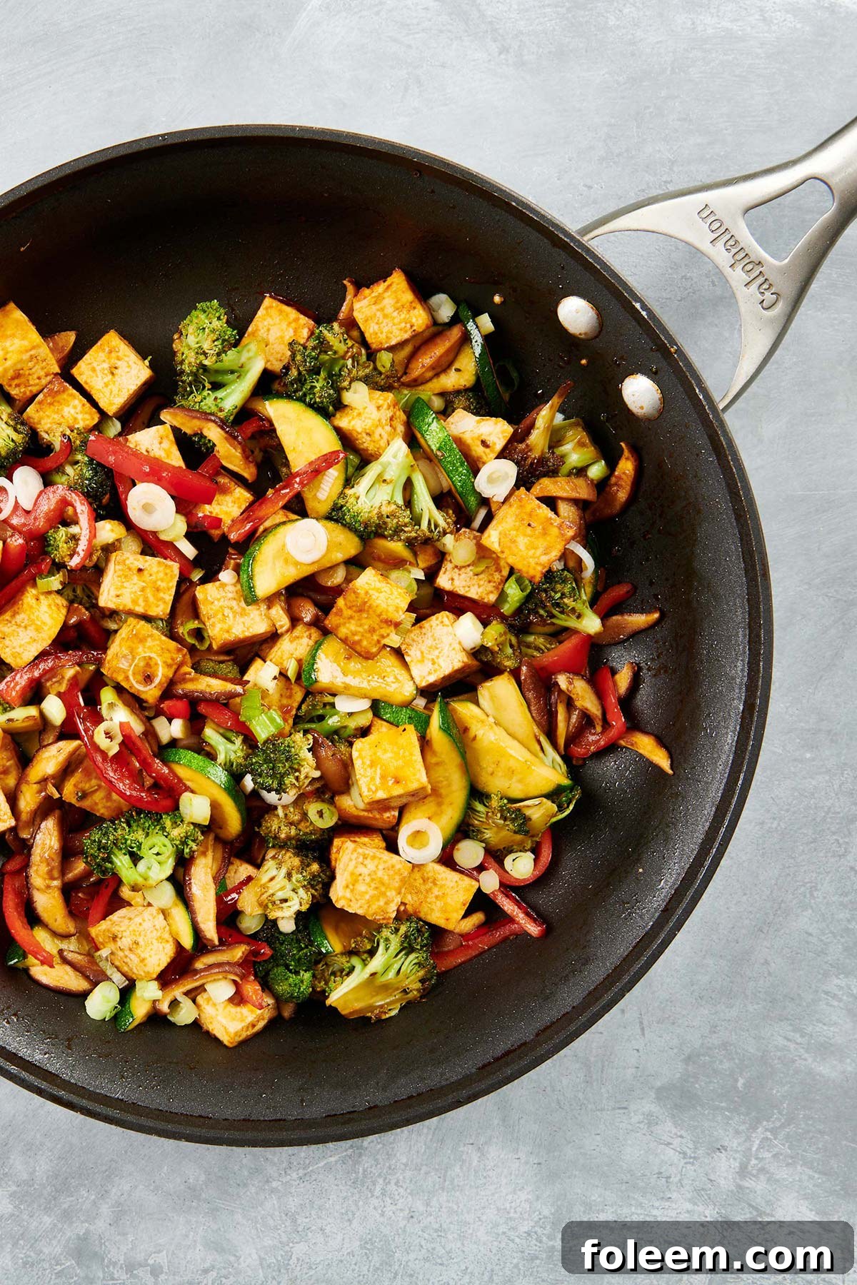 Stir Fried Crispy Tofu and Vegetables in a skillet.