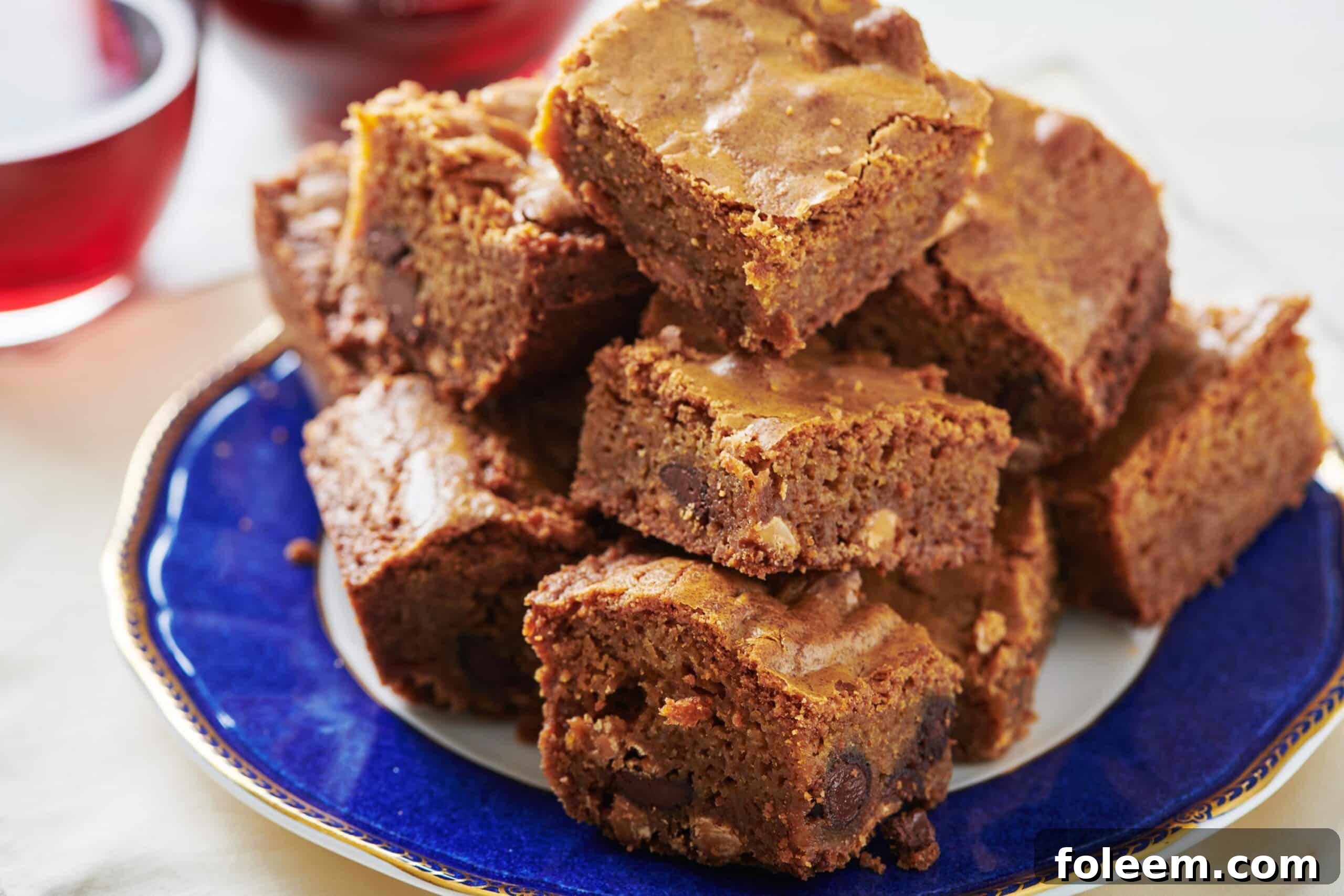 Butterscotch Brownies aka Blondies piled on blue plate.