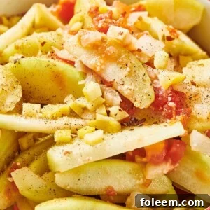 Stewed chayote with tomatoes and onions in cooking pot