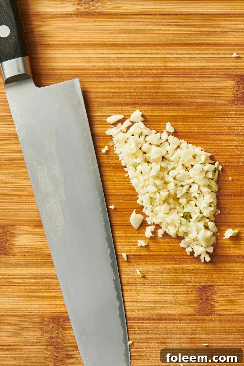 Finely minced garlic and knife.