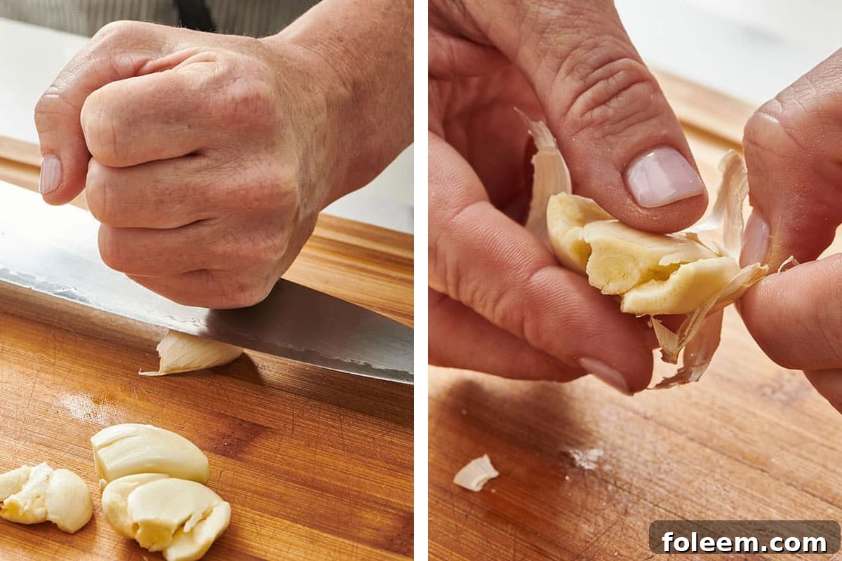 Smashing fresh garlic with knife and peeling cloves.