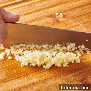 Mincing garlic with chef knife