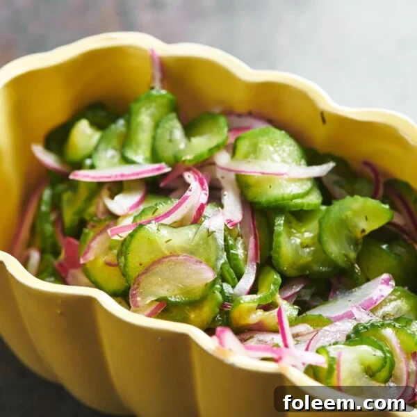Cucumber Salad in a yellow bowl.
