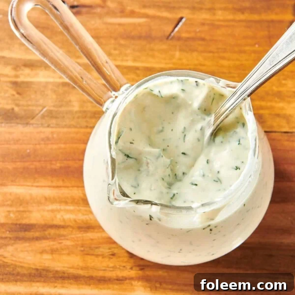 Small, handled glass serving cup of Dill Sauce.