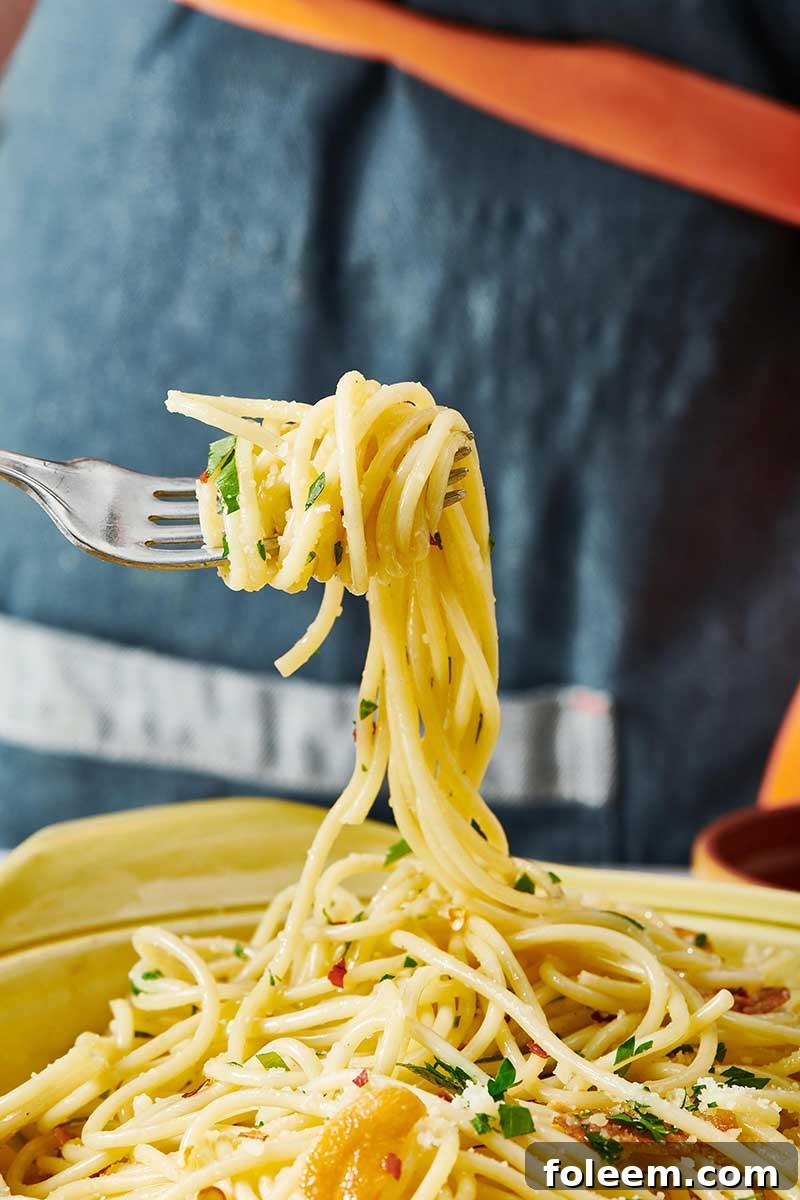 Twirling Pasta Aglio e Olio with fork.