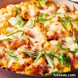 Baked Ziti garnished with thinly sliced basil.