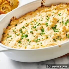 White dish with baked crab dip.