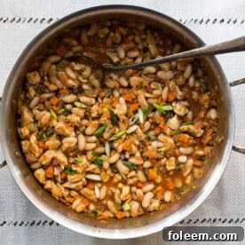 Spoon in a pot of Buffalo Chicken and White Bean Chili.